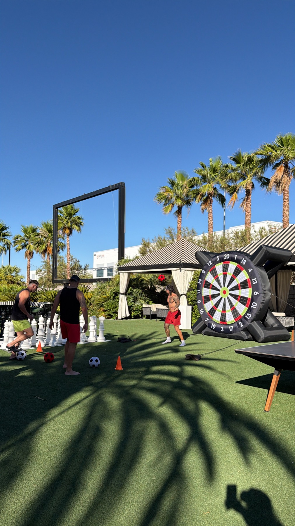 Giant kick dart and outdoor game stations at a Grazie Mille event