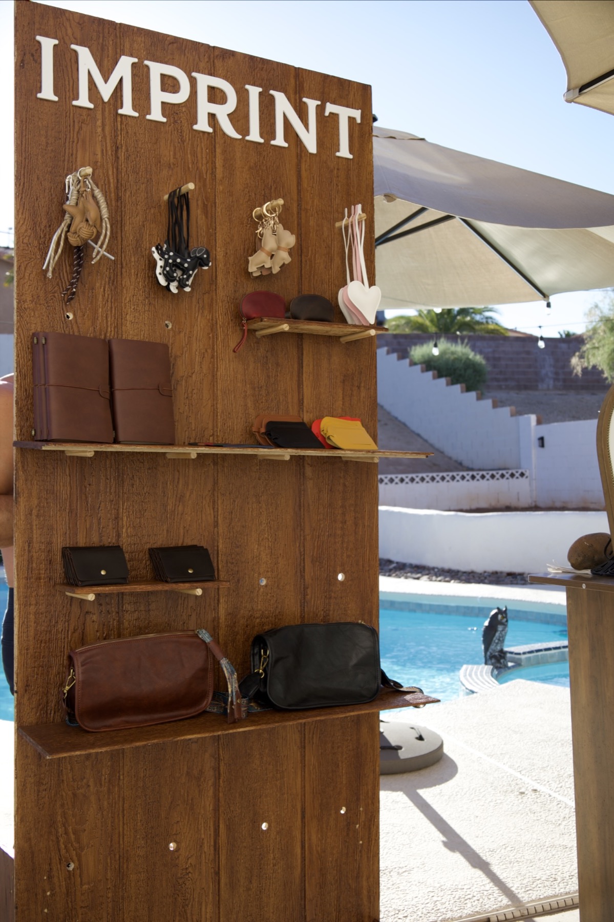 Imprint leather goods display at an outdoor event
