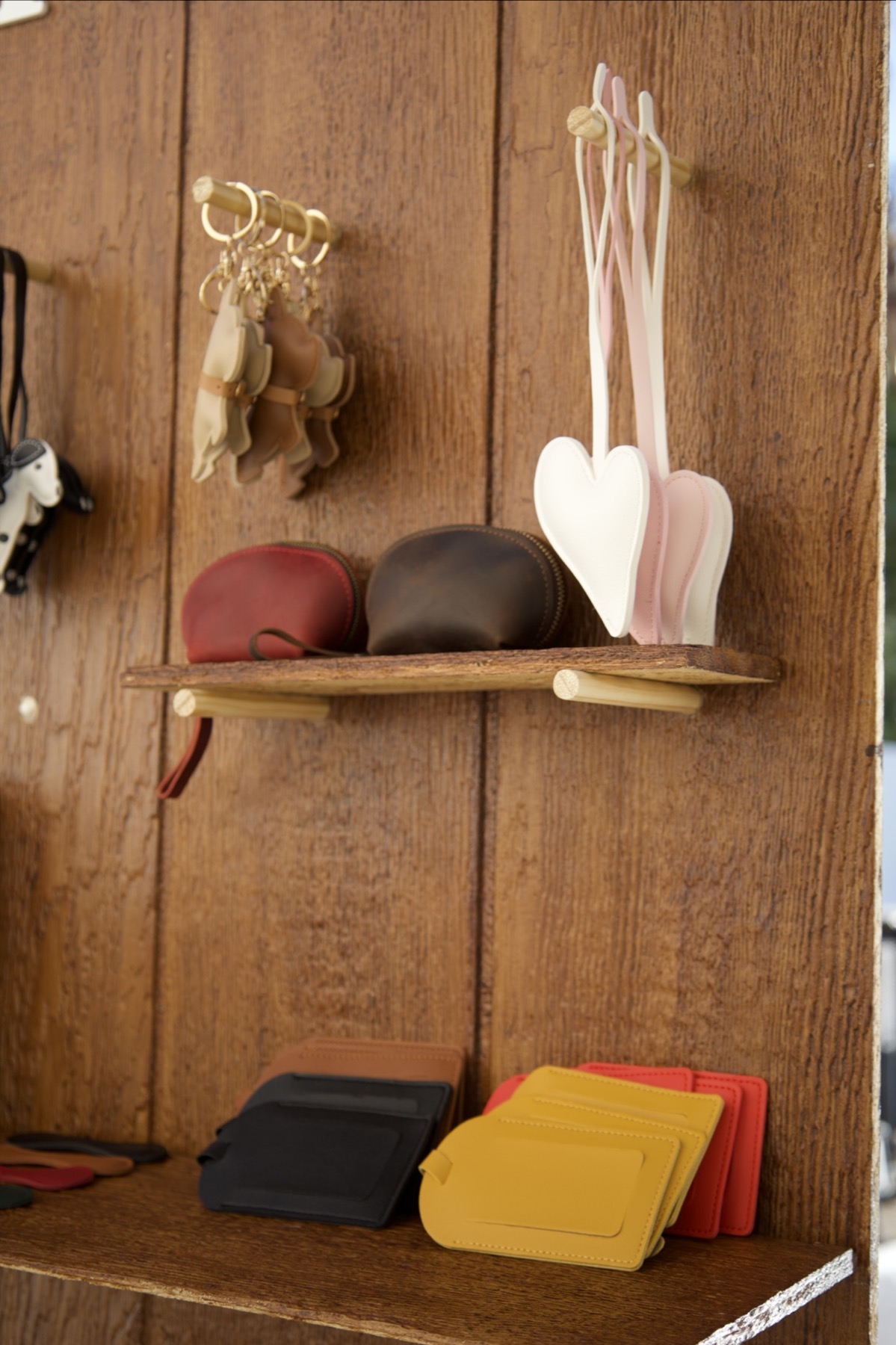 Curated leather accessories on the Imprint display board