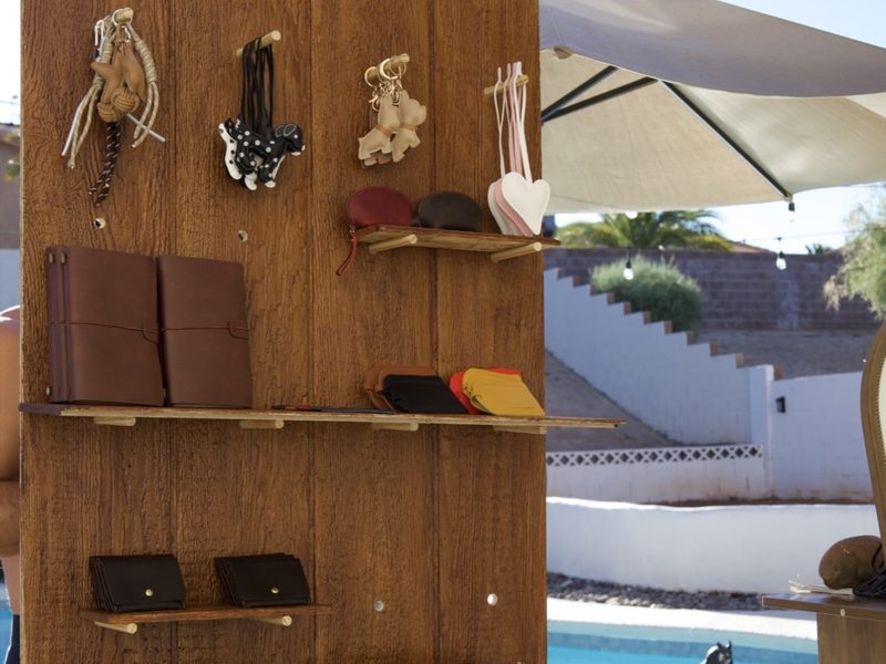 Imprint leather goods display at an outdoor event